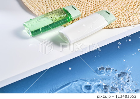 Sunscreen and gel by the water pool. 113483652