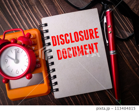 Clock,calculator,pen and notebook with text DISCLOSURE DOCUMENT on wooden background 113484815