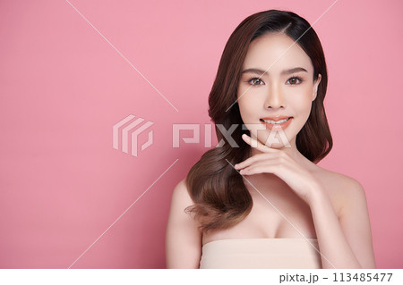 Beautiful young asian woman with clean fresh skin on pink background, Face care, Facial treatment, Cosmetology, beauty and spa, Asian women portrait. 113485477