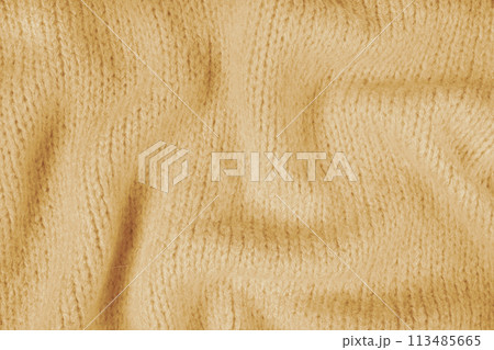 Close up background of yellow knitted fabric made of viscose yarn, soft background Close up background of yellow knitted fabric made of viscose yarn, soft background 113485665