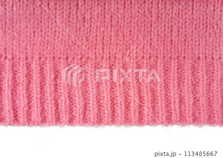 Pink knitted woolen jersey fabric, sweater texture with edge isolated on white background Pink knitted woolen jersey fabric, sweater texture with edge isolated on white background 113485667