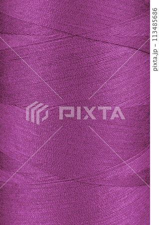 Texture of pink color threads in spool close up, macro Texture of pink color threads in spool close up, macro 113485686