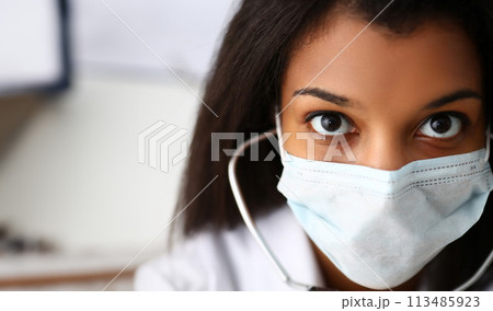 Black female doctor in a face mask 113485923