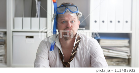 Man wearing suit and tie in goggles with snorkel 113485932