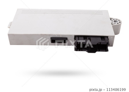 Plastic car engine control unit with metal elements on a white isolated background is the connecting center of various subsystems, units and assemblies. Monitoring the state of the moment. Spare part 113486199