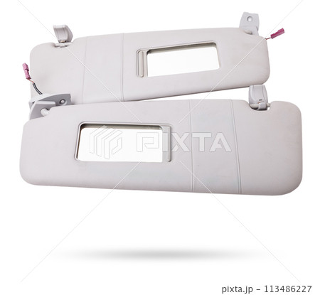 Sun visor with a mirror made of light gray plastic on a white background in a photo studio. Spare part of the car interior for replacement in a car service or for sale on auto dismantling. 113486227