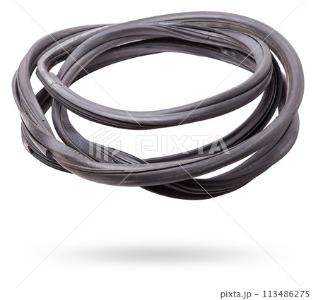 Rolled up black rubber sealant for elements of the car body, doors or trunk, for noise insulation, thermal and sound, preventing heat loss in the car interior. Sealing gasket for repair in a workshop. 113486275