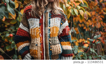 A woman in a colorful sweater standing next to some bushes, AI 113486531
