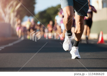 Marathon running in the light of morning. People feet on city road 113486620