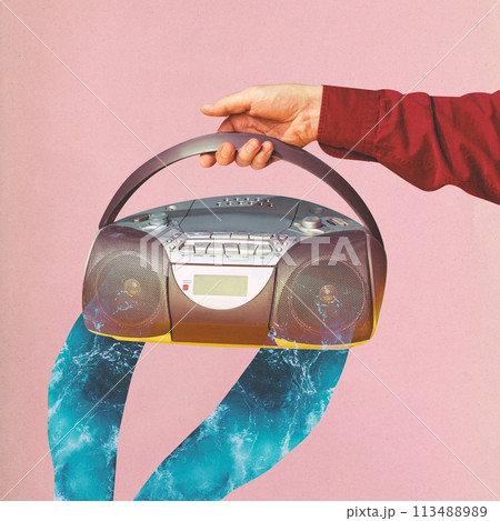 Contemporary art. collage. Hand holding radio with waves flowing from it on pink background. Music and its ability to evoke emotions. Contemporary art. collage. Hand holding radio with waves flowing from it on pink background. Music and its ability to evoke emotions. 113488989