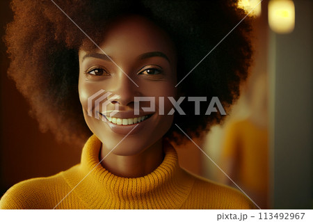 African American young woman with afro hair smiling in a yellow sweater. Beautiful woman standing African American young woman with afro hair smiling in a yellow sweater. Beautiful woman standing 113492967