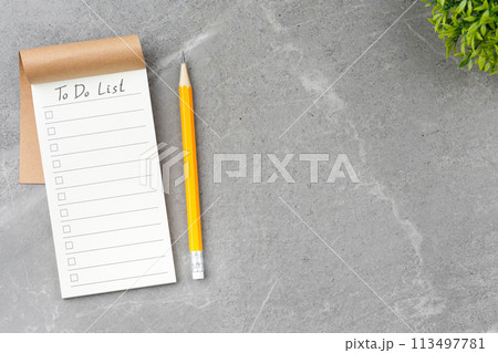 Open notebook on gray marble background. Open notebook on gray marble background. 113497781