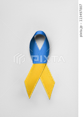 yellow blue ribbon on white background 113497807