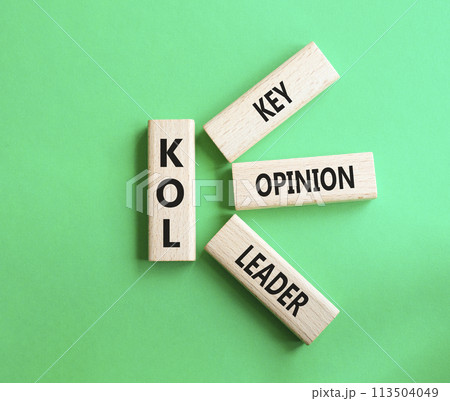 KOL - Key Opinion Leader symbol. Concept word KOL on wooden blocks. Beautiful green background. Business and KOL concept. Copy space. KOL - Key Opinion Leader symbol. Concept word KOL on wooden blocks. Beautiful green background. Business and KOL concept. Copy space. 113504049