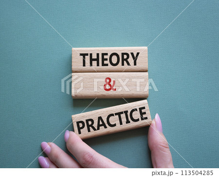 Theory and Practice symbol. Concept word Theory and Practice on wooden blocks. Businessman hand. Beautiful grey green background. Business and Theory and Practice concept. Copy space Theory and Practice symbol. Concept word Theory and Practice on wooden blocks. Businessman hand. Beautiful grey green background. Business and Theory and Practice concept. Copy space 113504285