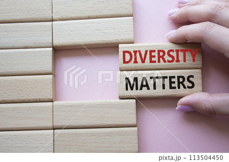 Diversity matters symbol. Wooden blocks with words Diversity matters. Businessman hand. Beautiful pink background. Business and Diversity matters concept. Copy space. 113504450