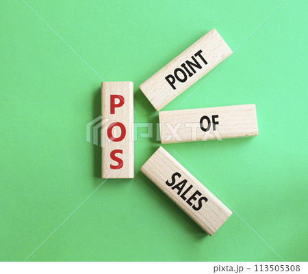 POS - Point Of Sales symbol. Wooden cubes with words POS. Beautiful green background. Business and POS concept. Copy space. 113505308