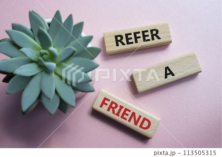 Refer a Friend symbol. Concept words Refer a Friend on wooden blocks. Beautiful pink background with succulent plant. Business and Refer a Friend concept. Copy space. Refer a Friend symbol. Concept words Refer a Friend on wooden blocks. Beautiful pink background with succulent plant. Business and Refer a Friend concept. Copy space. 113505315