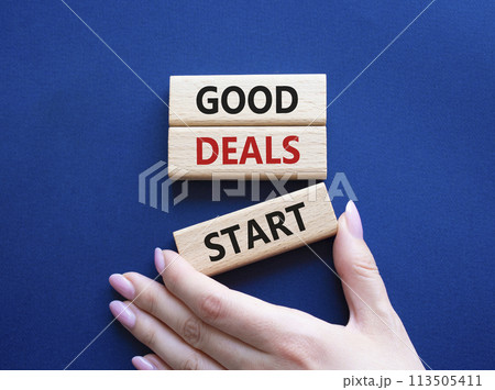 Good Deals Start symbol. Concept words Good Deals Start on wooden blocks. Businessman hand. Beautiful deep blue background. Business concept. Copy space. Good Deals Start symbol. Concept words Good Deals Start on wooden blocks. Businessman hand. Beautiful deep blue background. Business concept. Copy space. 113505411