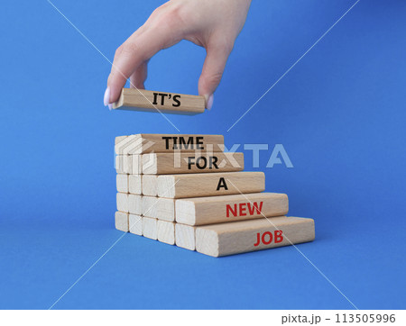 It is time for a new job symbol. Concept words It is time for a new job on wooden blocks. Businessman hand. Beautiful blue background. Business concept. Copy space. 113505996