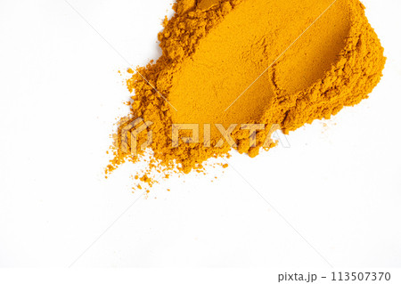 A smear of turmeric on a white background, top view 113507370