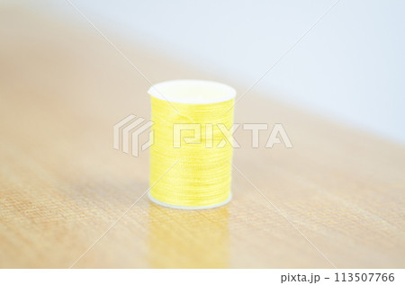 Yarn on brown table. 113507766