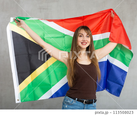 Young happy pretty woman displaying flag of south africa 113508023