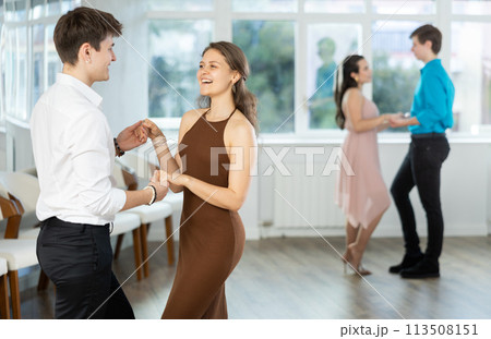 Hispanic guy practicing sensual bachata with girl in dance class 113508151