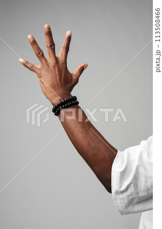 African Man Arm Raised in the Air 113508466