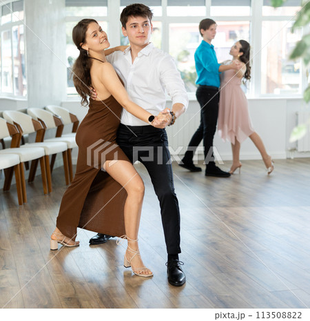 Tango performed by young couple in choreographic studio Tango performed by young couple in choreographic studio 113508822