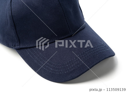 Navy Blue Baseball Cap on a White Background With Clear Lighting Navy Blue Baseball Cap on a White Background With Clear Lighting 113509139