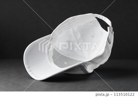 White Baseball Cap on Black Background 113510122