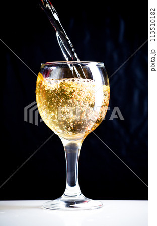 White wine pouring White wine pouring 113510182