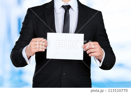 Businessman showing his business card 113510770