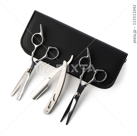 Hairdressing scissors with leather case on white background Hairdressing scissors with leather case on white background 113511042