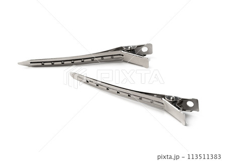 Close up of metal hair clips isolated on white background Close up of metal hair clips isolated on white background 113511383