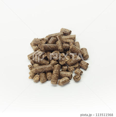 stack of wooden pellets for bio energy, white background, isolated 113511568