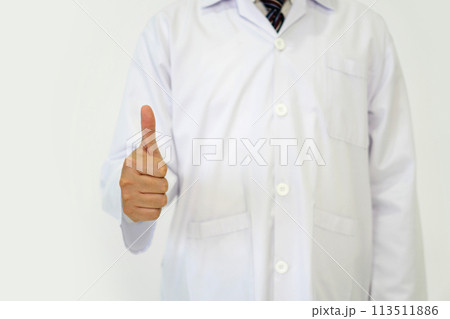 Doctor or scientist in a white lab coat standing with finger thumbs up. Portrait on white background, studio shot. 113511886