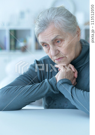 Close up portrait of a sick senior woman 113512050