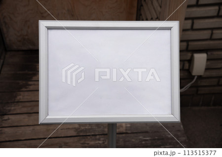 Large blank billboard on a street wall, banners with room to add your own text 113515377