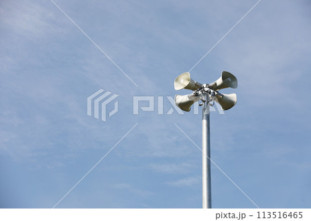 Horn speaker with blue sky background 113516465