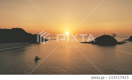 Sunset seascape of ocean bay at tropic islands aerial. Nobody nature landscape with palm trees Sunset seascape of ocean bay at tropic islands aerial. Nobody nature landscape with palm trees 113517423