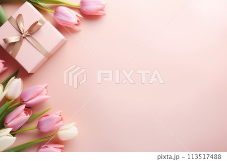 Spring greeting card with gift boxes and tulips on soft pink background for Mother's Day. View from above. Copy space for design. 113517488