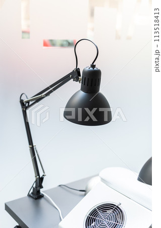 Vintage black desk lamp in nails business salon 113518413