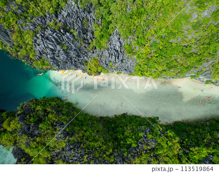 Kayaks on clear waters in Big Lagoon. Miniloc Island. El Nido, Palawan. Philippines. 113519864