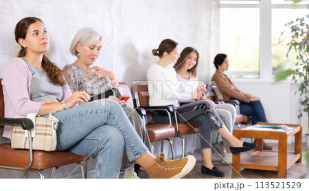 Young girl sitting at hall of civil service building 113521529