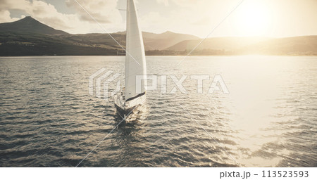 Slow motion sun reflection at yacht on ocean bay aerial. Sailing regatta race on boat at sunshine 113523593