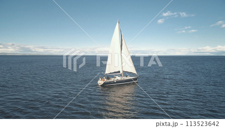 Slow motion of yacht reflection at sea gulf aerial. Sail boat reflect at ocean bay. Racing sailboat Slow motion of yacht reflection at sea gulf aerial. Sail boat reflect at ocean bay. Racing sailboat 113523642