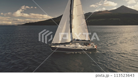 Sun yachts with white sails at ocean bay aerial. Luxury yachting on sailboat in open sea lifestyle 113523643
