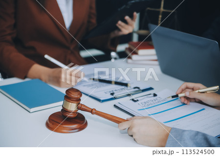 Businessman and lawyer discuss the contract document. Treaty of the law. Sign a contract business. 113524500